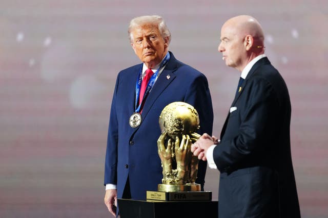 <p>Donald Trump on stage with Gianni Infantino at the World Cup draw</p>