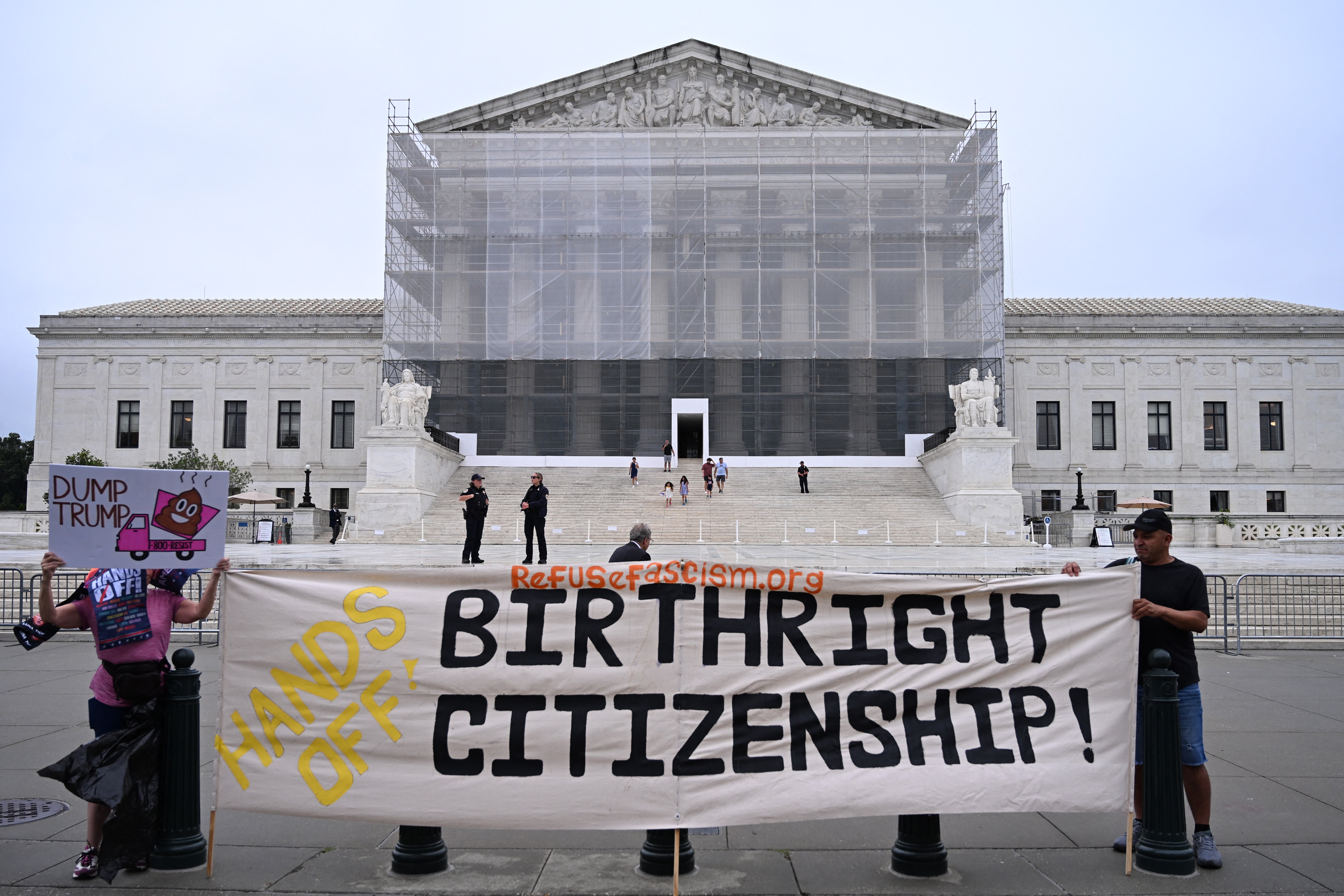 <p>Demonstrators holds up an anti-Trump sign outside the US Supreme Court in Washington, DC, on June 27, 2025</p>