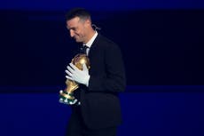 Fifa apologises for making Argentina’s World Cup-winning coach wear gloves to touch trophy