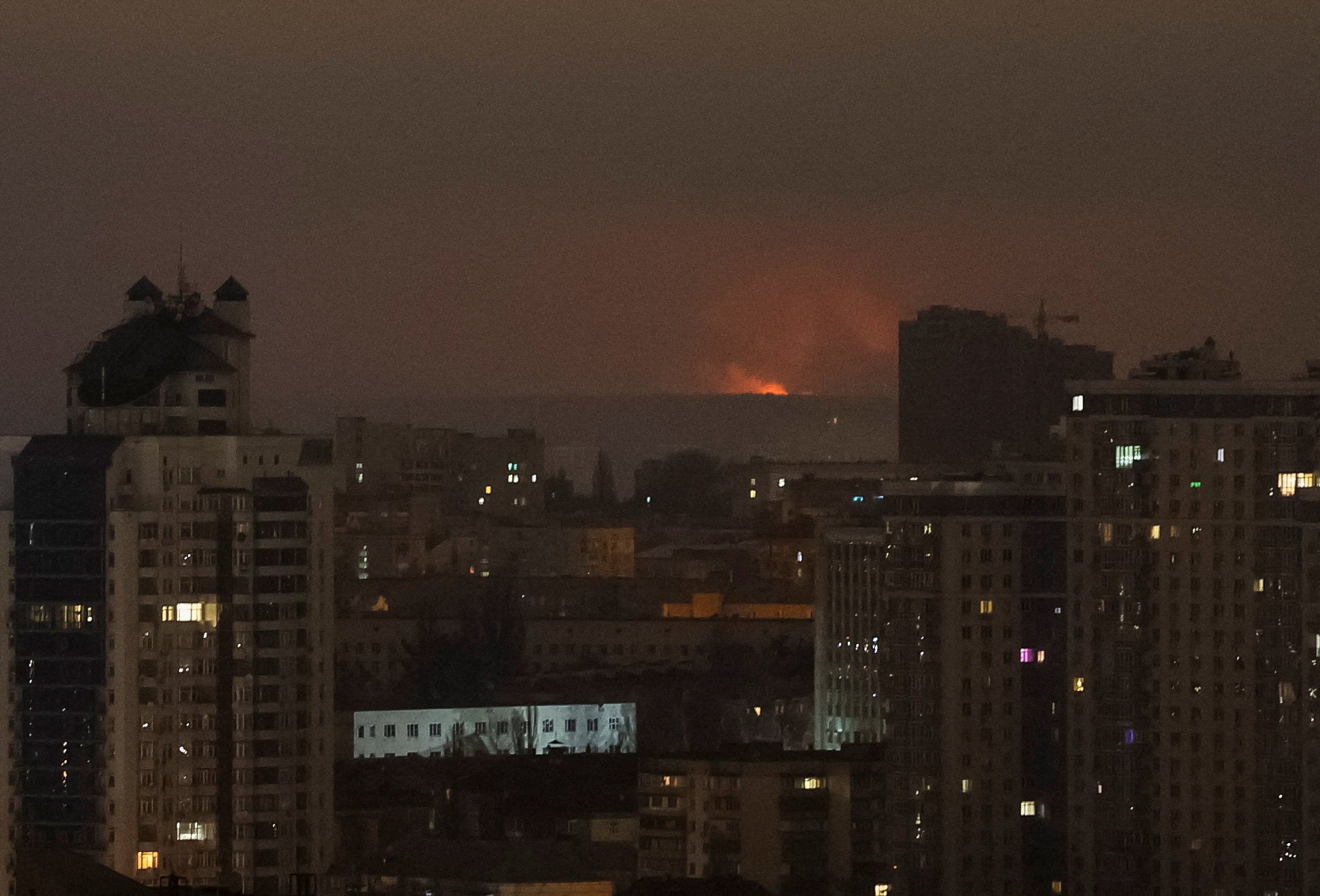 An explosion of a drone lights up the sky over the city during a Russian missile and drone strike, amid Russia's attack on Ukraine, in Kyiv