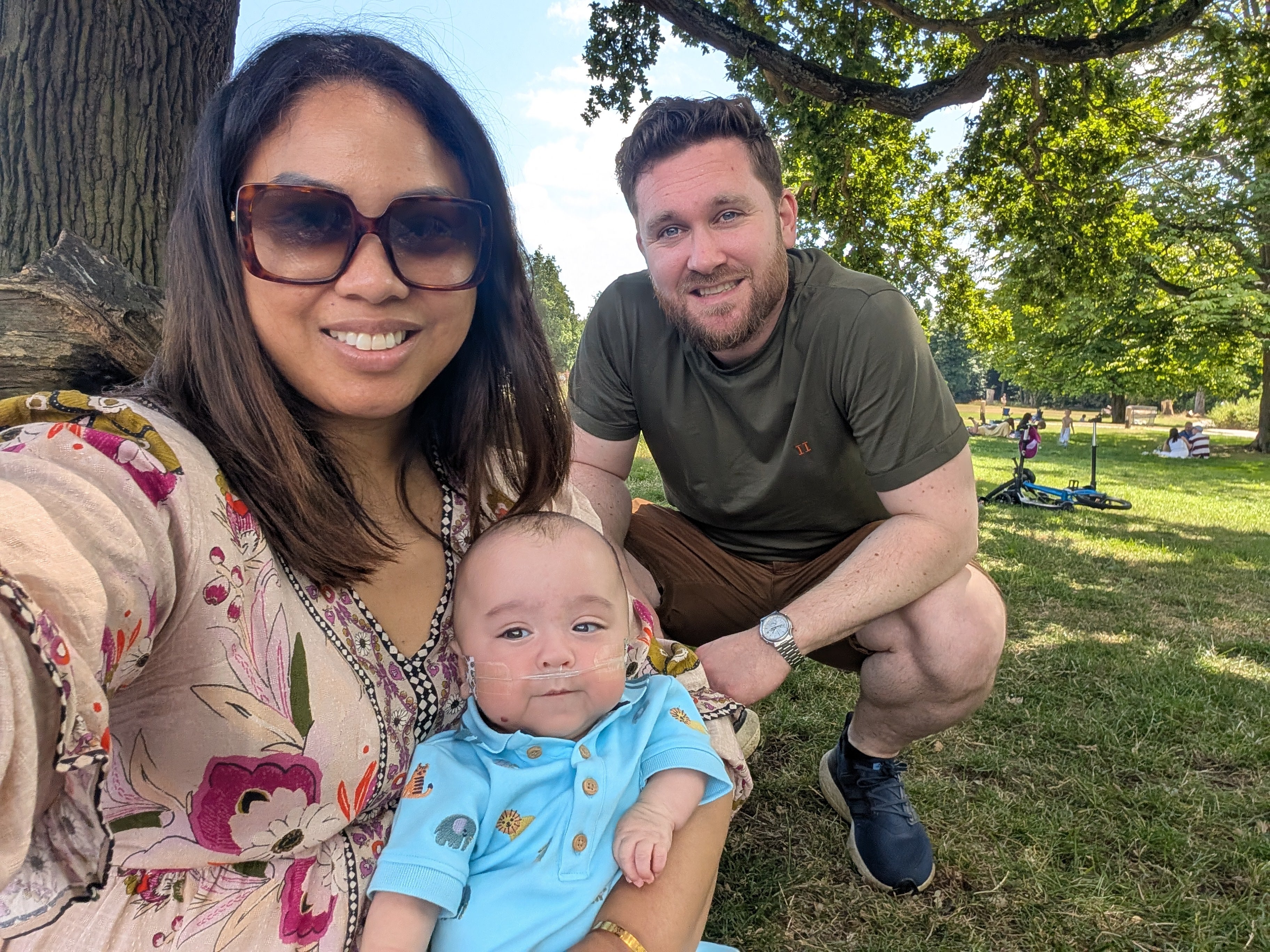 <p>Anita Ibrahim-Goddard and Paul Goddard with their son Adam - who they have described as “heroic”</p>