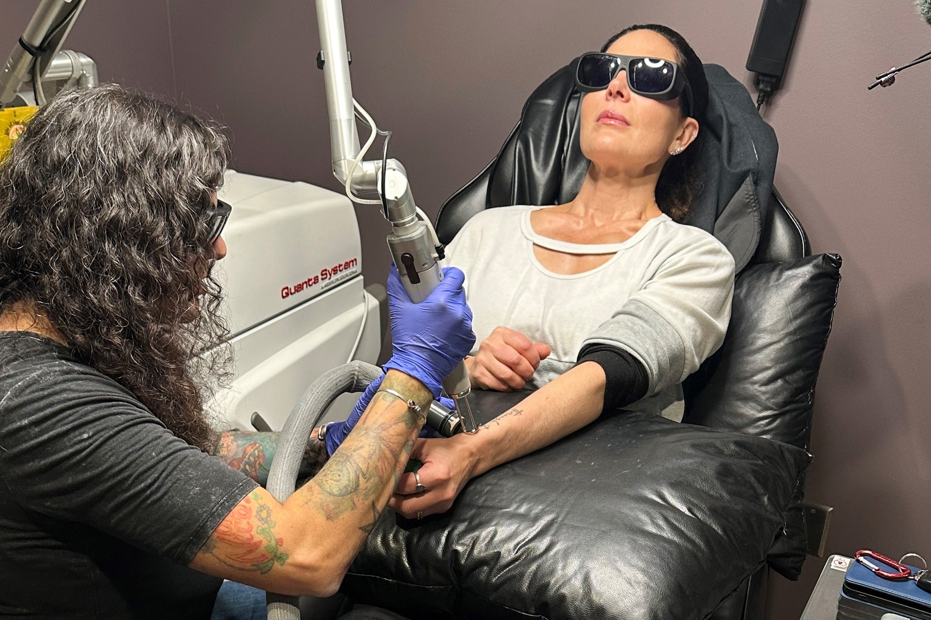 Tracy Herrmann has one of her tattoos removed by Chroma Tattoo Studio Laser Tattoo Removal owner Jaime Howard