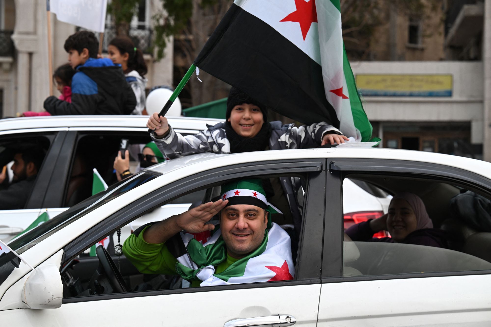 Syrian citizens celebrate the anniversary of Assad fleeing the country in December 2025
