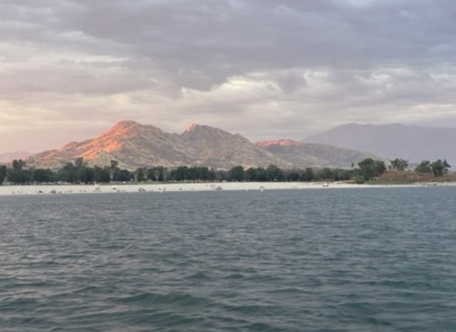 <p>A father has been hailed a hero after keeping his young son afloat when their kayak capsized in a move that led to his death, officials said </p>