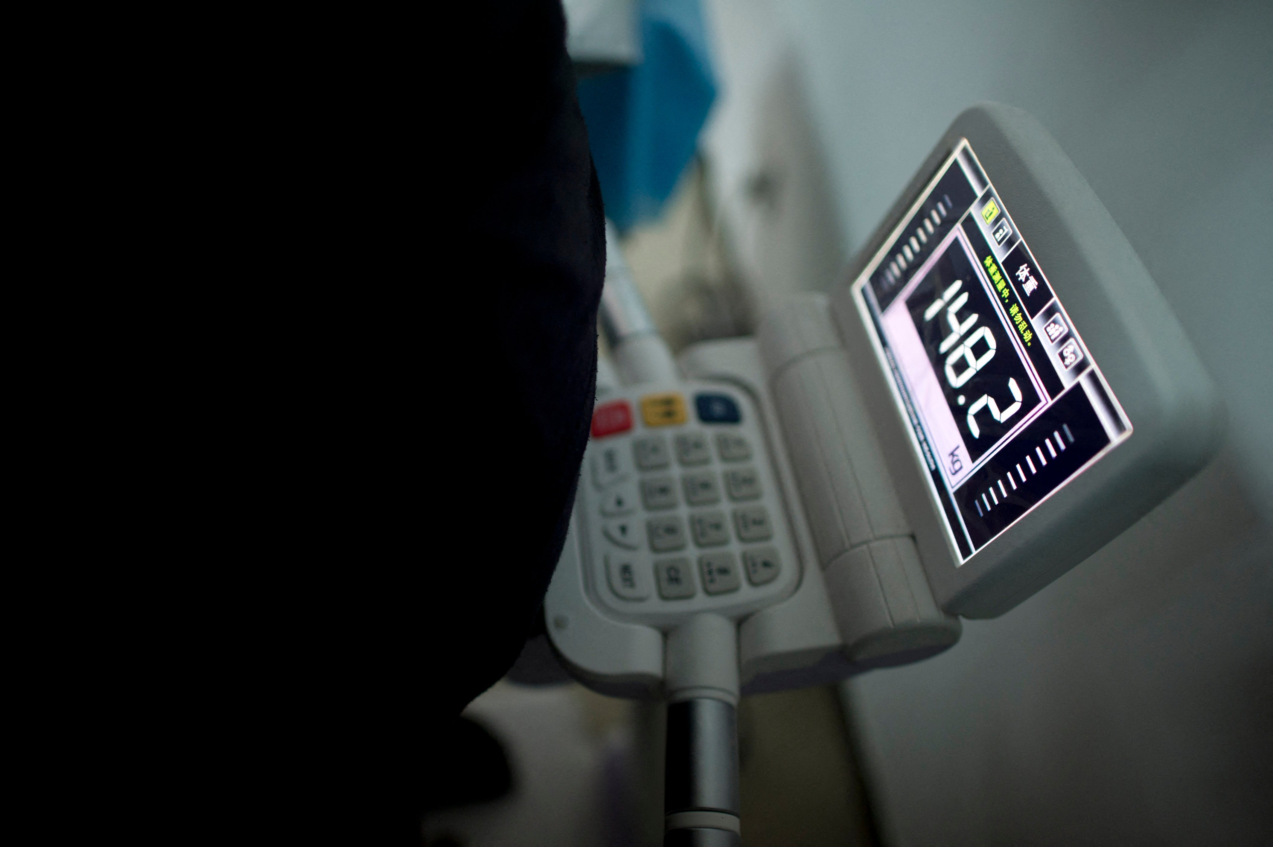 File. Scale shows weight of a child during at a hospital in Beijing