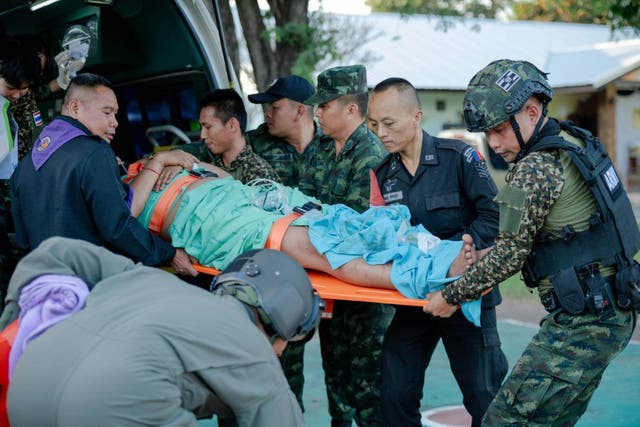 <p>In this photo released by Royal Thai Army, a wounded Thai soldier is carried to be transferred to a hospital in Sisaket province, Thailand, Sunday</p>
