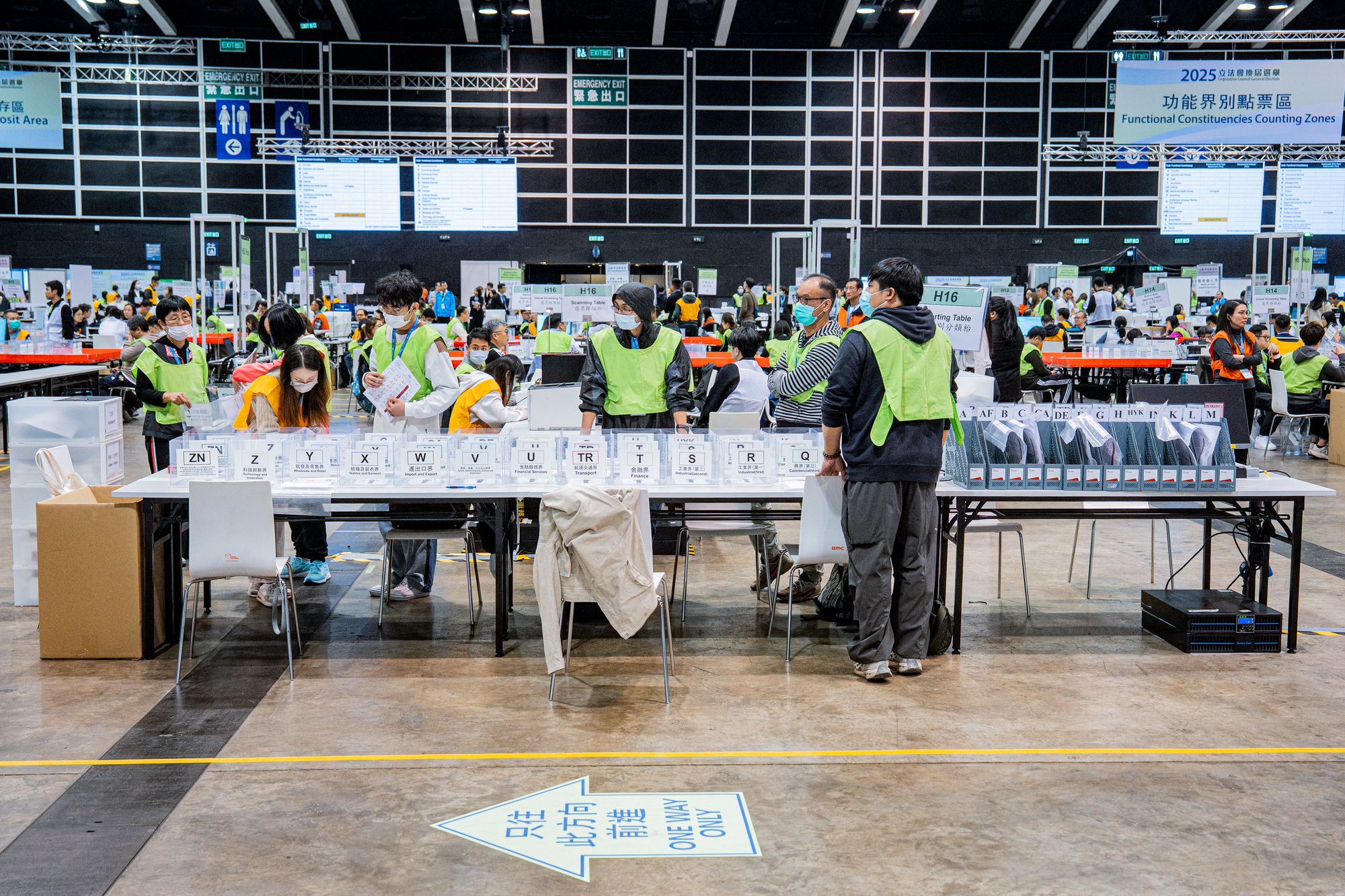 Election officials start to count the ballots after polls closed in the Legislative Council elections in Hong Kong on 8 December 2025