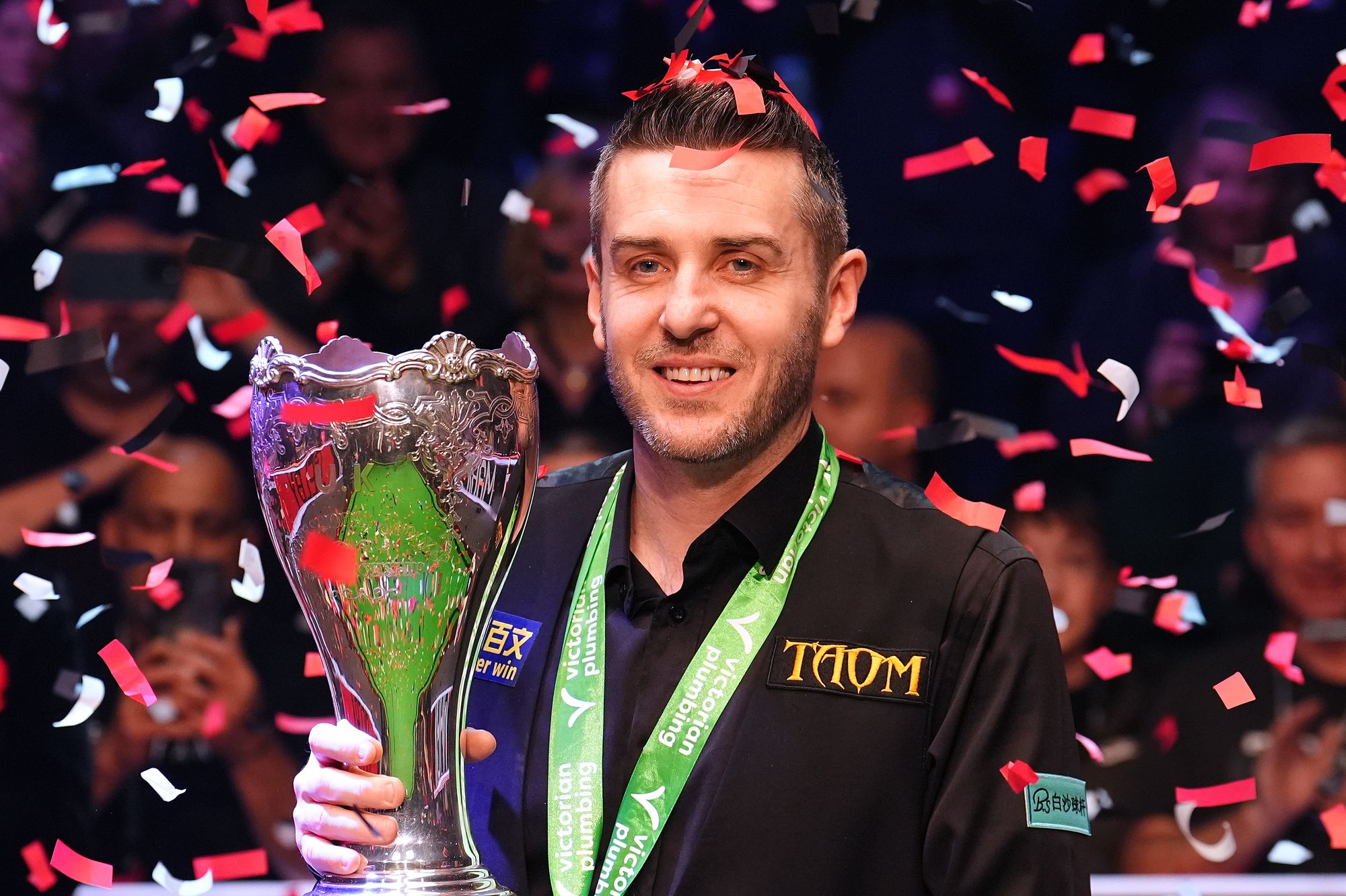 Mark Selby celebrates with the trophy