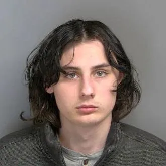 Joel Edwards has been accused of making finger guns at a school, prompting fears of an imminent school shooting