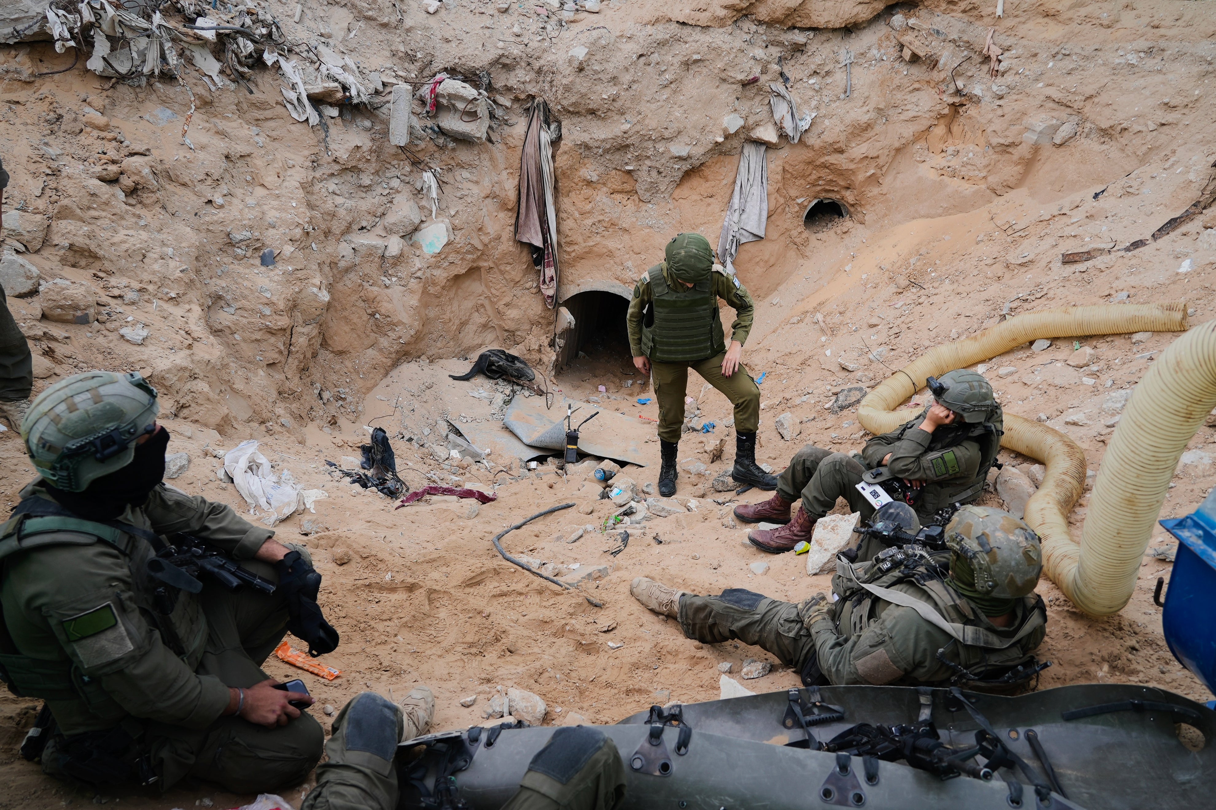 Israeli soldiers at the entrance of a tunnel where the IDF says Hamas kept hostages and its top commanders