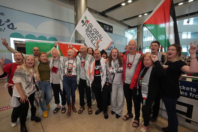 Paddy Kelly (fifth left), Tadhg Hickey (seventh left), Diarmuid Mac Dubhglais (fourth right) and Maureen Almai (third right), were some of the Irish citizens detained by Israel following the interception of the Global Sumud Flotilla (PA)