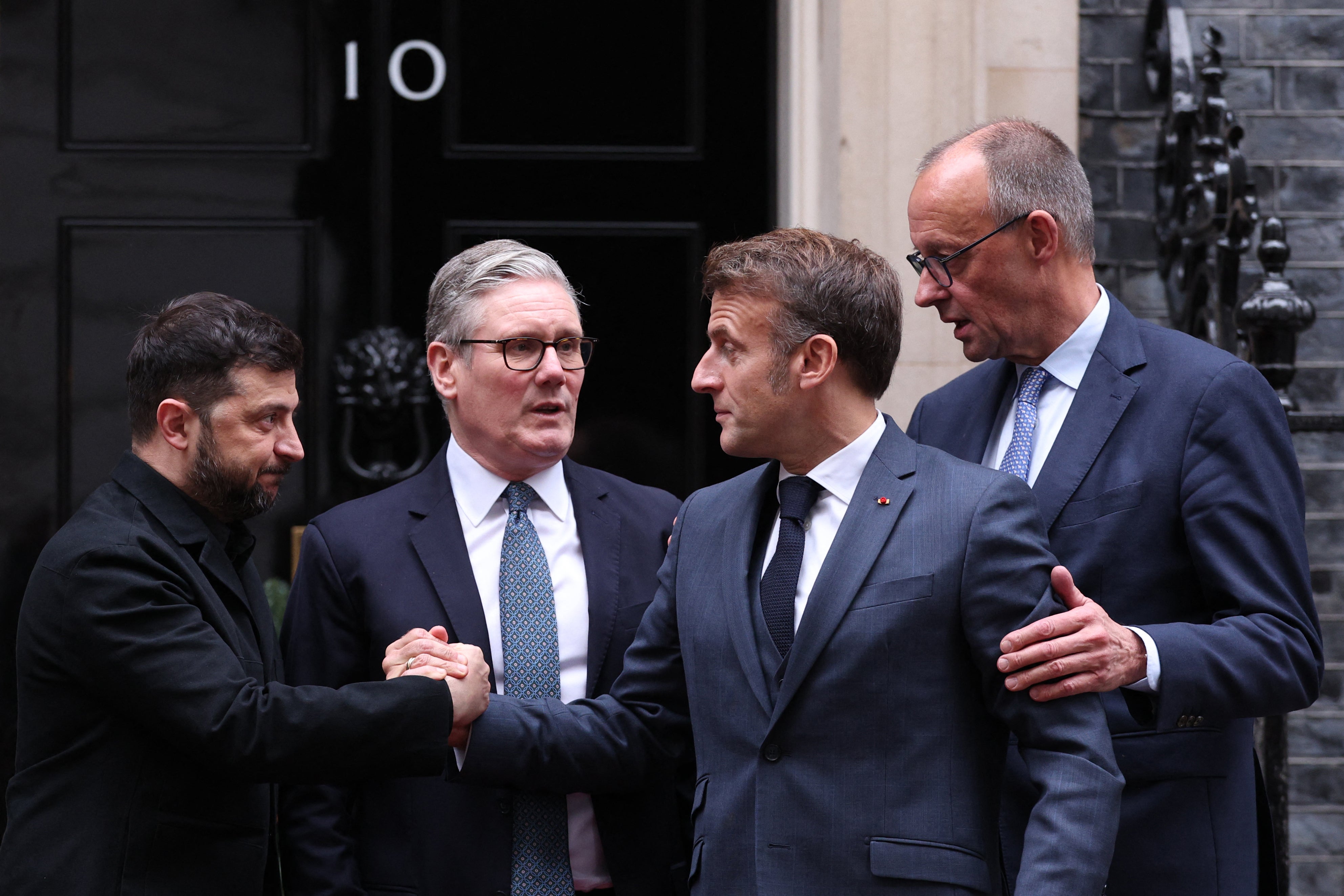Ukraine's president Volodymyr Zelensky, Britain's prime minister Keir Starmer, France's president Emmanuel Macron and Germany's chancellor Friedrich Merz chat on the 10 Downing Street doorstep after a meeting in central London