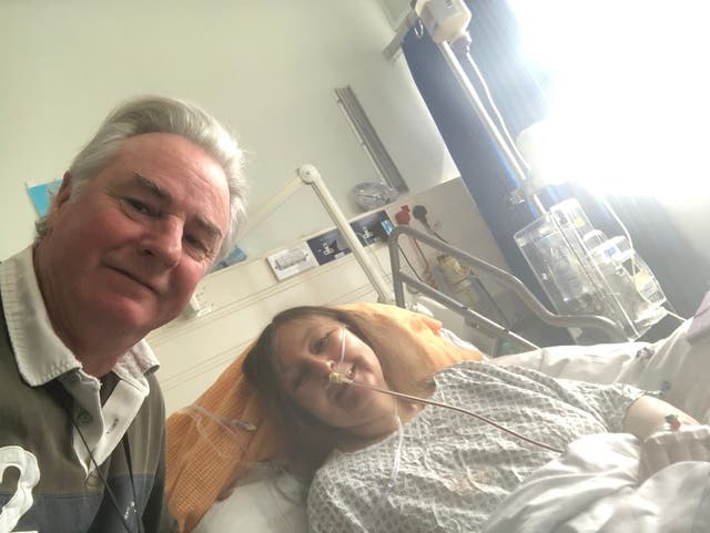 <p>Heulwen Wyatt, one day after her operation, with her husband Rob</p>