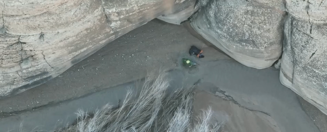 <p>Austin Dirks was in Arches National Park in eastern Utah when he became stuck in quicksand. He is seen on drone footage trapped in a remote area </p>