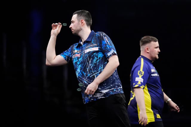 <p>Luke Humphries (left) in action against Luke Littler (John Walton/PA)</p>