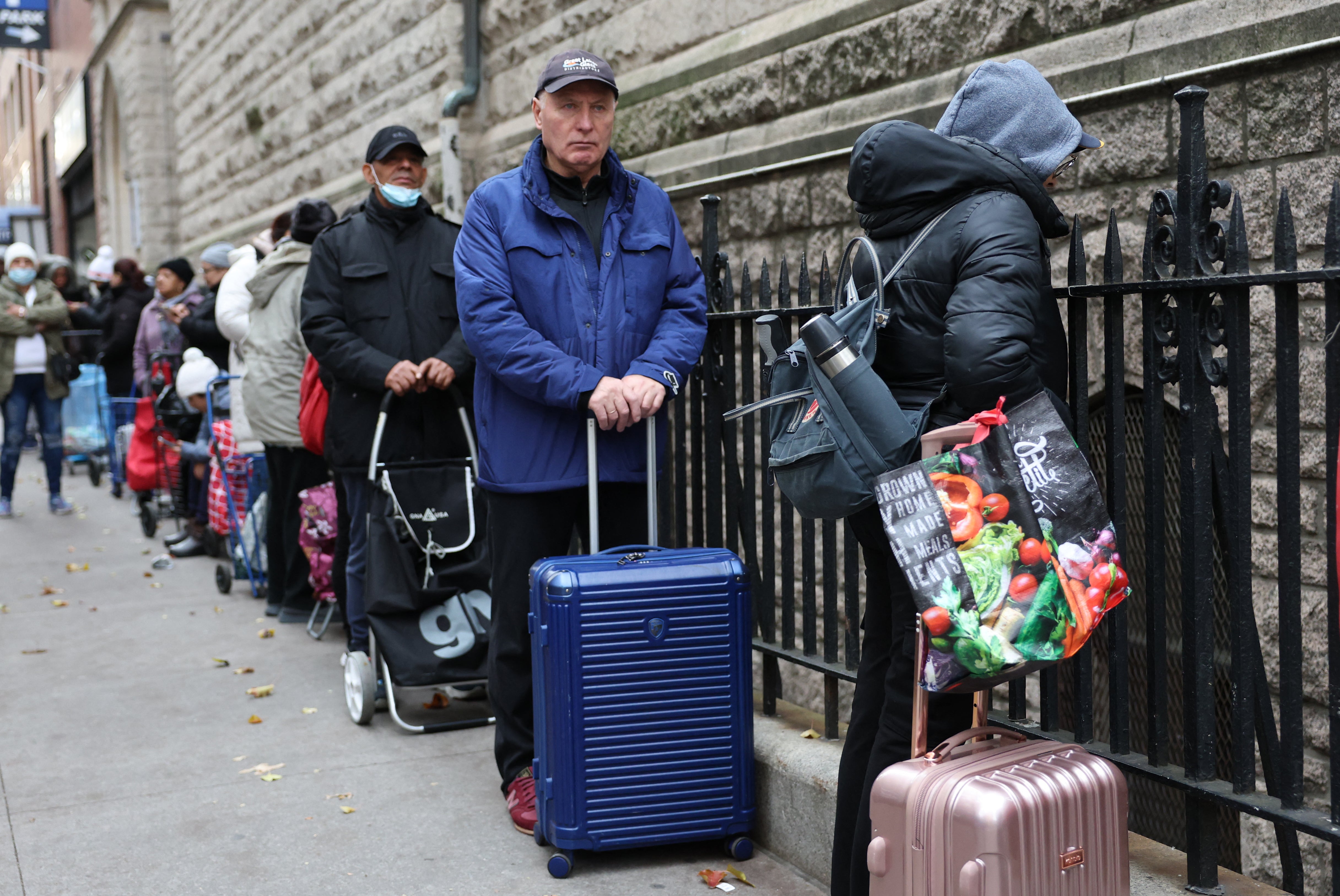 People wait in line to receive food for Thanksgiving at the West Side Campaign Against Hunger on the Upper West Side on November 25. WSCAH is one of the largest and most successful food pantries in New York City. After imposing new restrictions on who can receive SNAP assistance, the Trump administration has threatened to cut off the program from Democratic-led states — including New York, where 3 million people rely on food aid — if they don’t comply with data requests