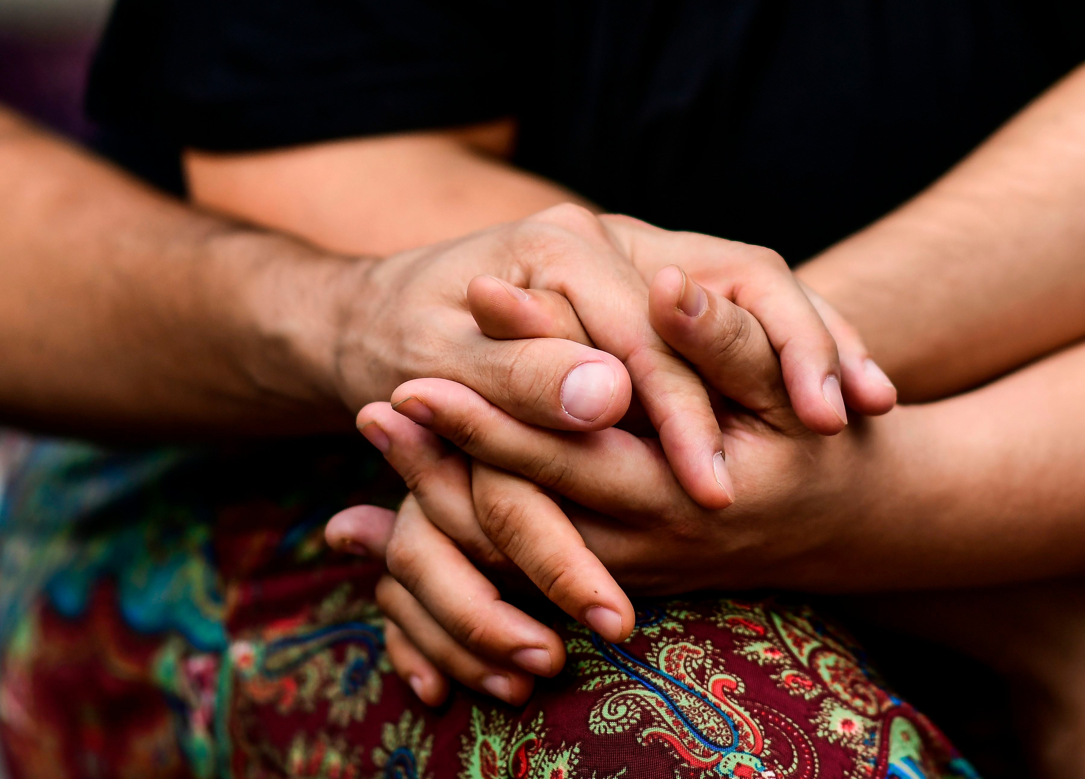 People join hands at the Pueyrredon Park in Buenos Aires