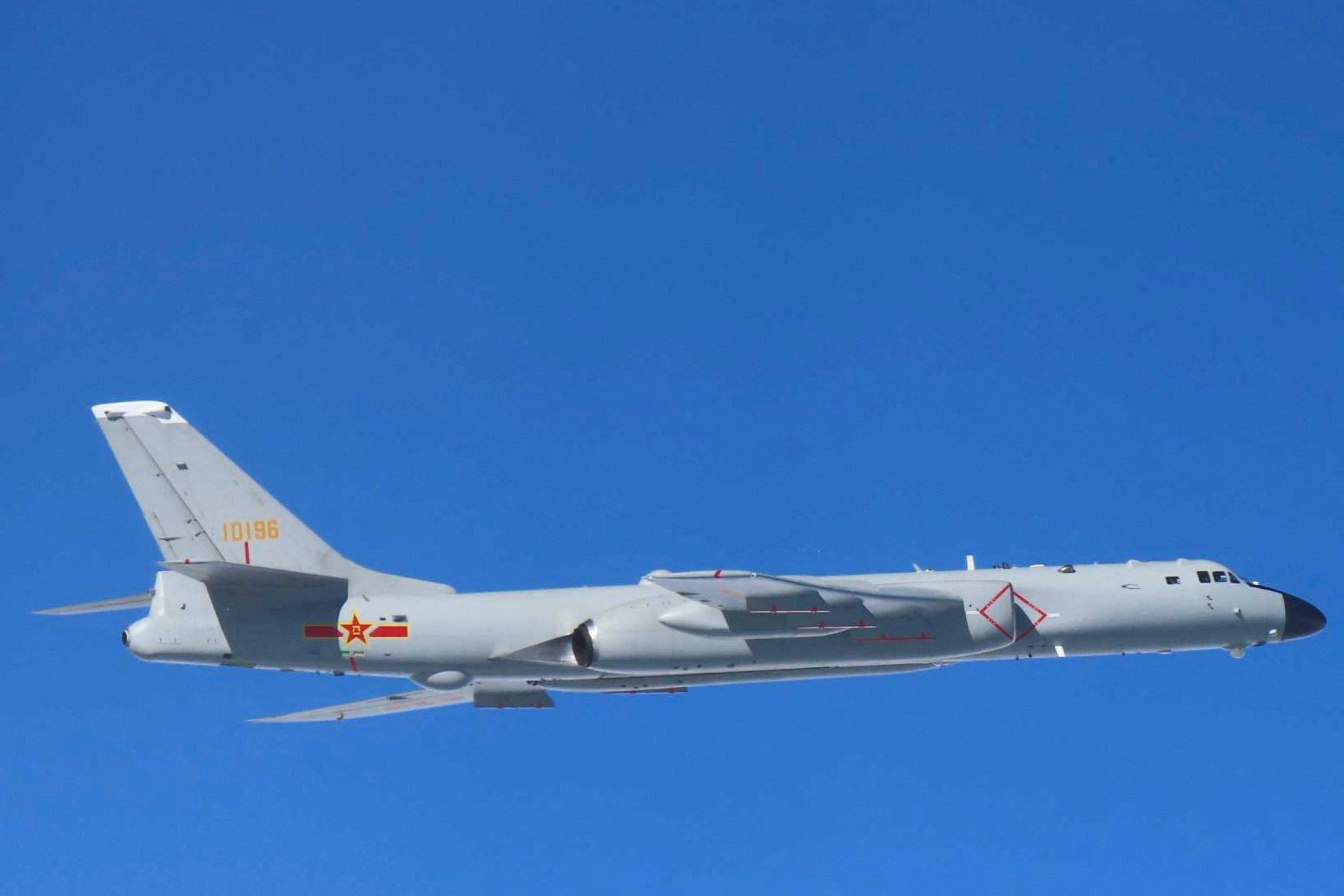 File: Japan's Ministry of Defense shows a Chinese Xian H-6 bomber flying over the sea near Japan. South Korea and Japan reacted furiously on December 10 after Chinese and Russian military aircraft conducted joint patrols around the two countries, with both Seoul and Tokyo scrambling jets in December 2025 (Japan's Ministry of Defense)