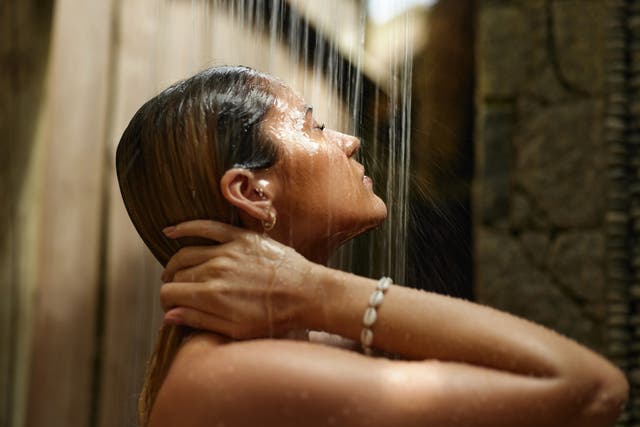 <p>Dark showers: Experts say a candlelit bathe before bed could be the answer to an easier night’s sleep </p>