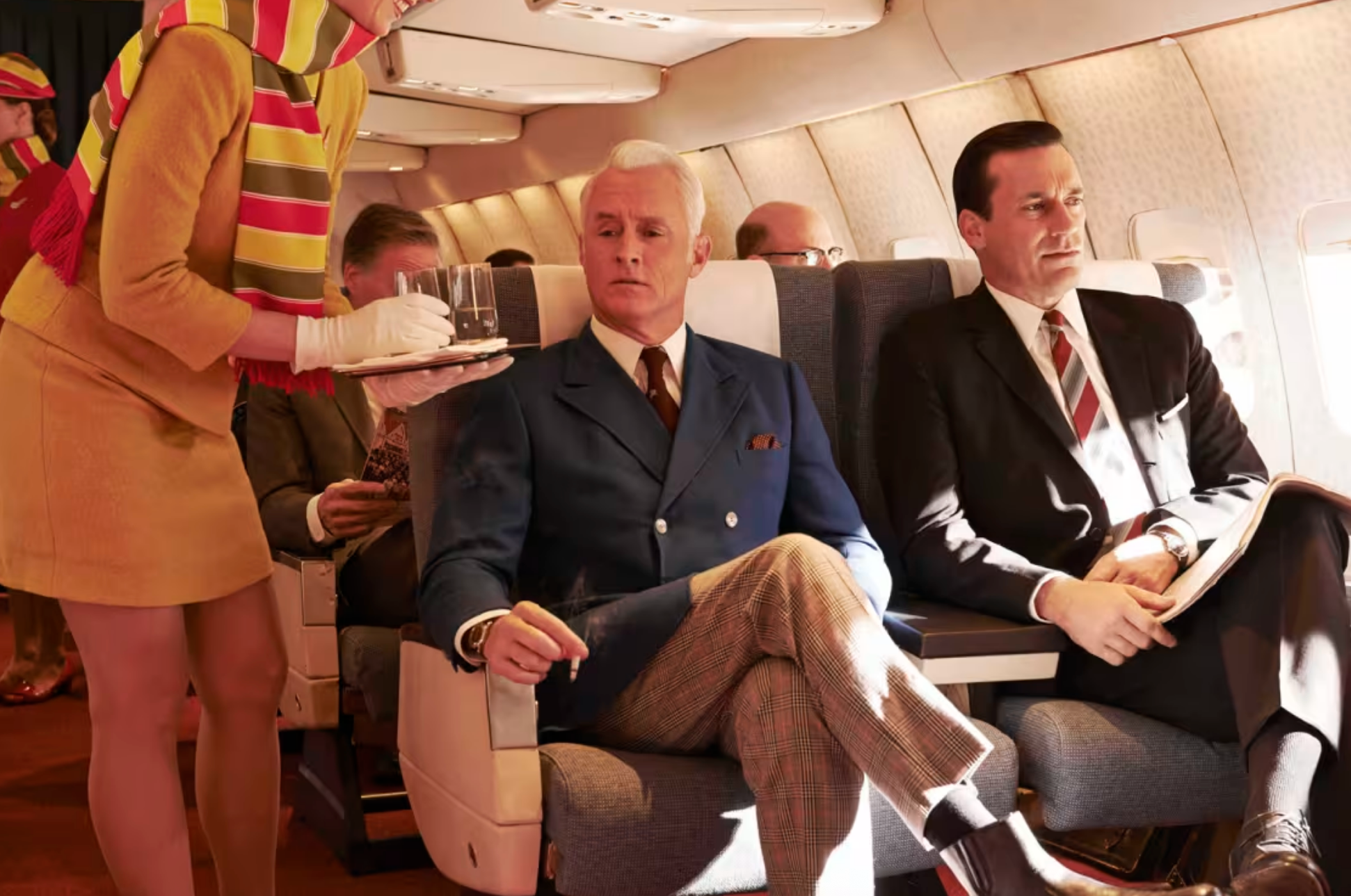 <p>Suited and booted: John Slattery as Roger Stirling and Jon Hamm as Don Draper in ‘Mad Men’ </p>