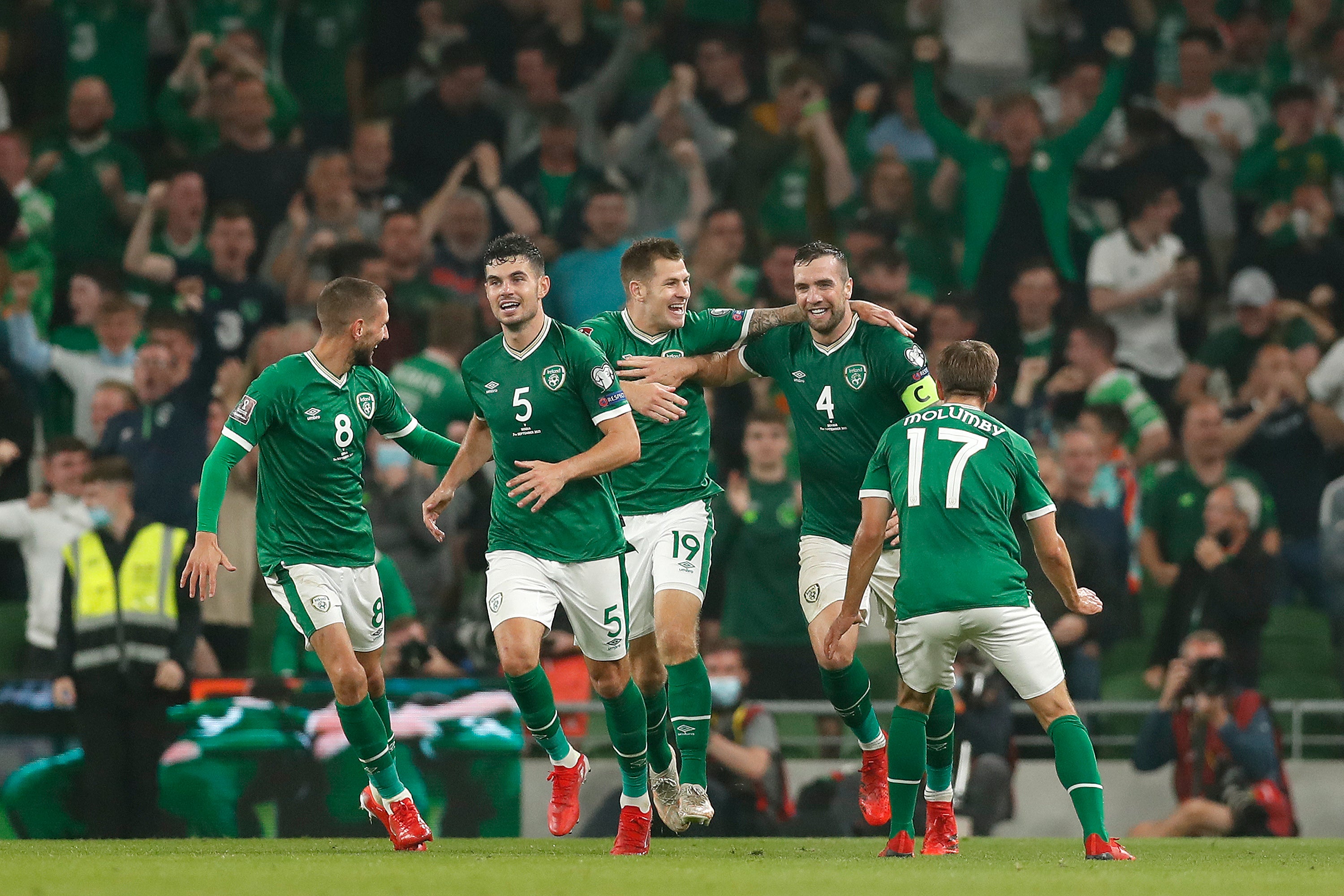 Conor Hourihane, John Egan, James Collins and Shane Duffy of Republic of Ireland celebrate against Serbia in 2022