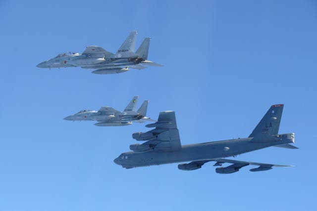 <p>The 6th Air Wing of Japan Air Self-Defense Force's F-15 fighters hold a joint military drill with the US B-52 bomber over Sea of Japan</p>