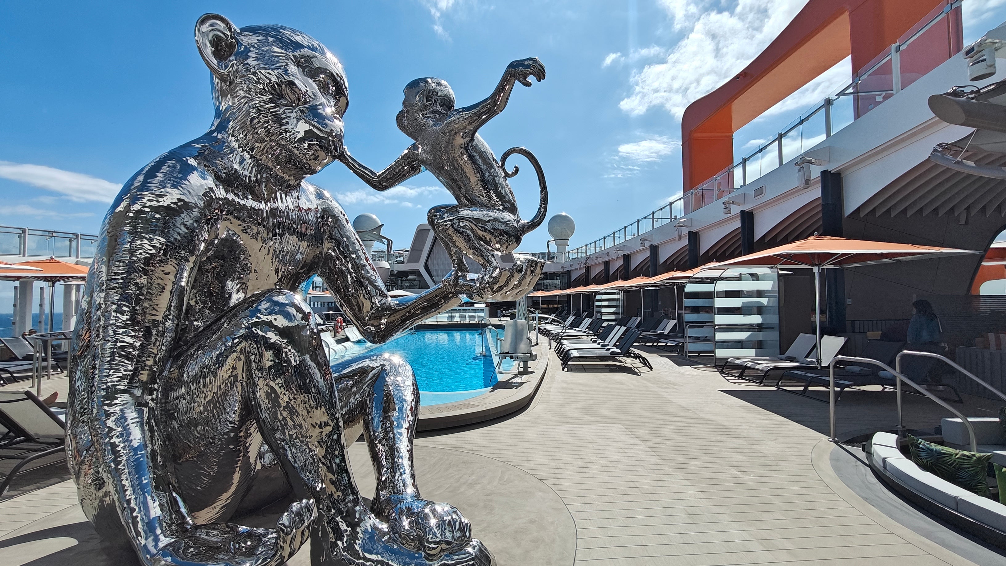 A giant monkey statue greets guests on the pool deck aboard the Celebrity Xcel