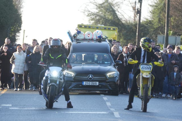 The cortege, led by two motorcyclists, arrives for the funeral of Tadgh Farrell at St Mary’s Church (Brian Lawless/PA)