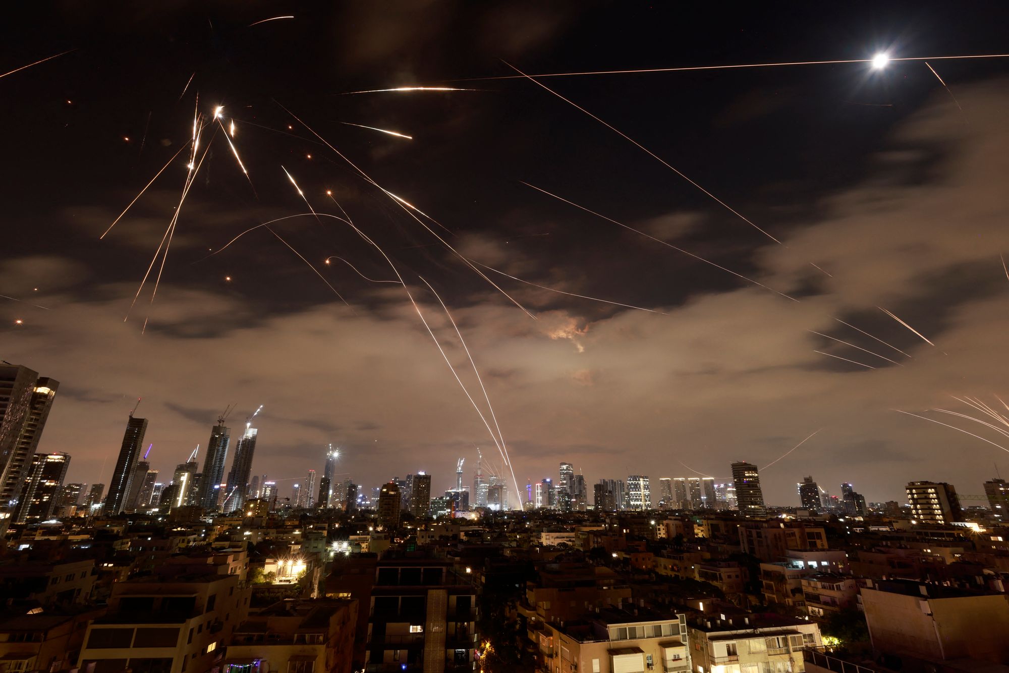 Israeli air defence systems are activated to intercept Iranian missiles over Tel Aviv in June
