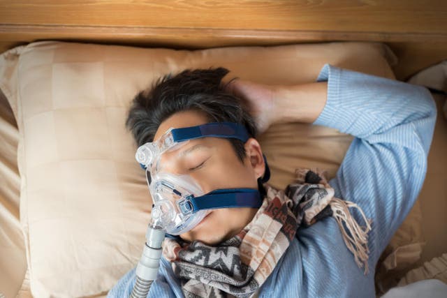 <p>Picture of a patient undergoing CPAP</p>