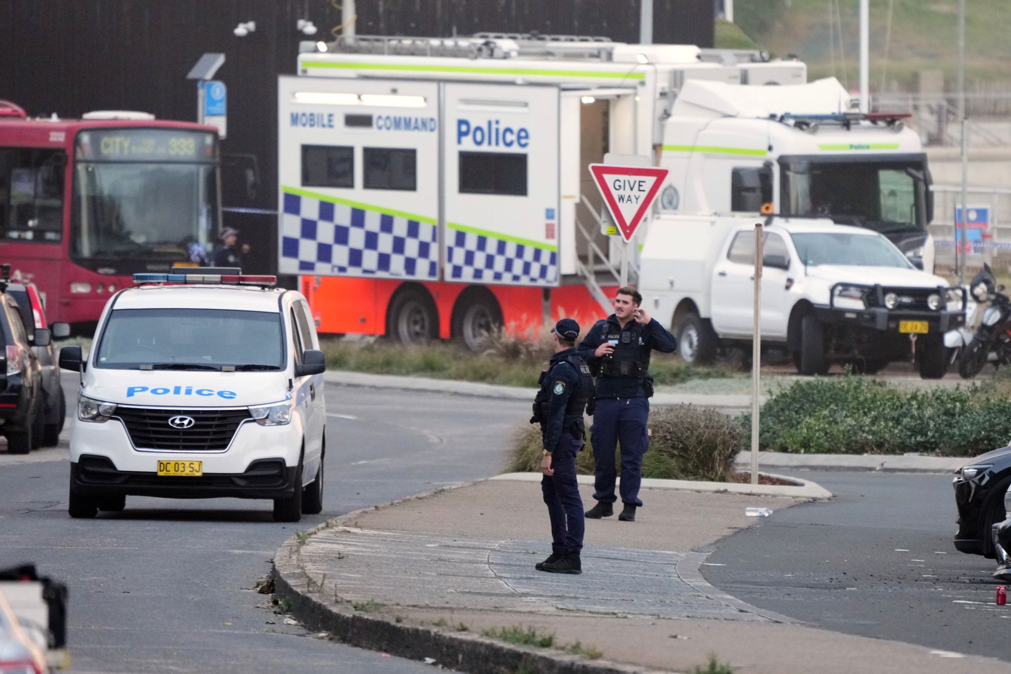 Police patrol in the early morning following a shooting Sunday at Sydney's Bondi Beach, Monday