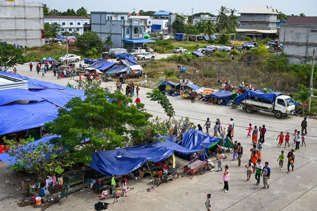 <p>Displaced residents walk at a temporary camp in Cambodia's Banteay Meanchey province on amid clashes along Cambodia-Thailand border</p>