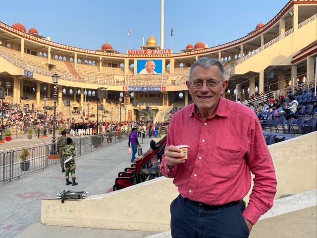 <p>Cross purposes: Simon Calder at India’s border stadium at the Wagah frontier, facing west towards Pakistan</p>