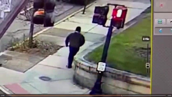 Police release footage of suspect in Brown University shooting as manhunt continues