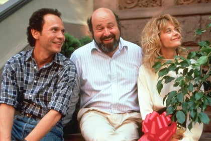 Filmmaker Rob Reiner on the set of 'When Harry Met Sally', with his stars Billy Crystal and Meg Ryan