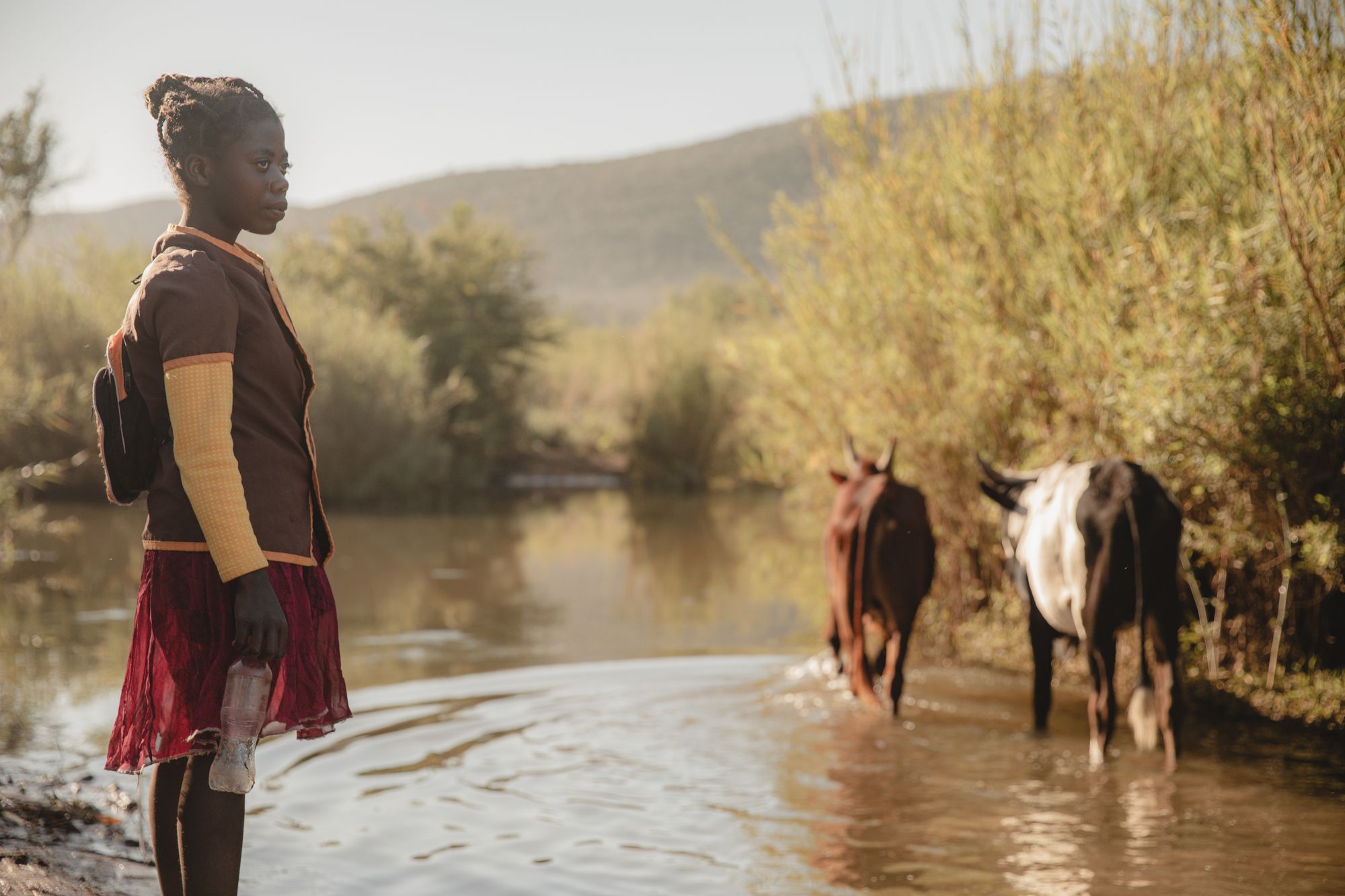 Nestelline, 13, collects water from the river Taranty Bas in the drought-stricken south of Madagascar