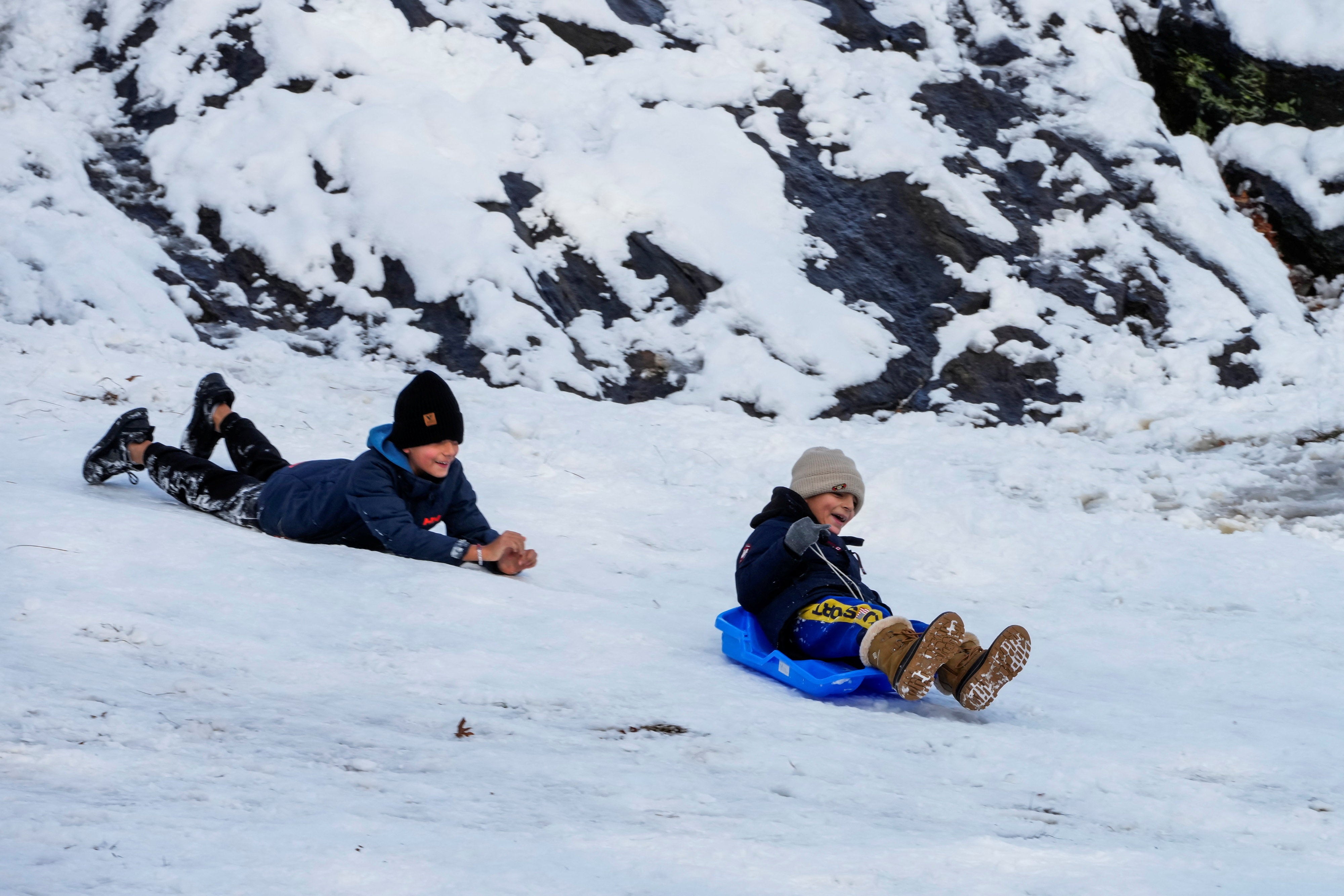 <p>Kids play in Central Park after a snowfall in New York City, U.S., December 14, 2025</p>