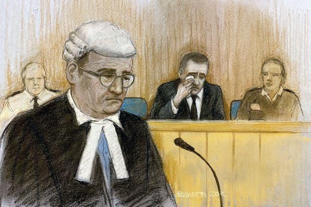 Court artist sketch by Elizabeth Cook of prosecution counsel Paul Greaney KC speaking as Paul Doyle wipes away tears at Liverpool Crown Court.