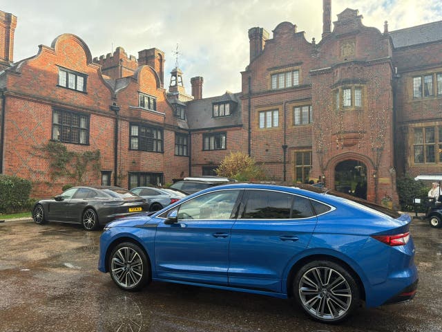 <p>The Škoda Enyaq Coupe parked outside Hanbury Manor in Hertfordshire</p>