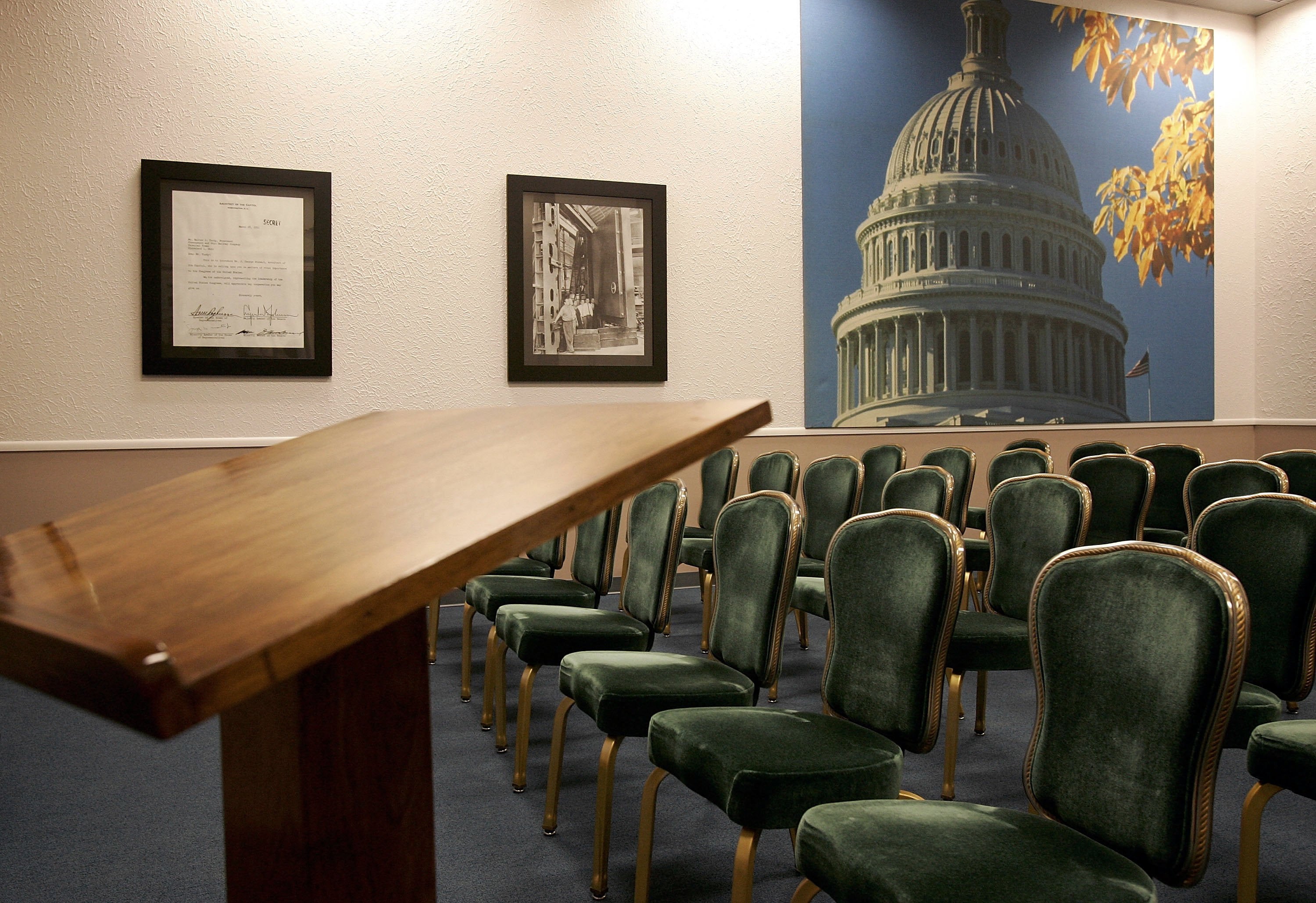 Two separate auditoriums, fitted with green corduroy-covered chairs and a red carpet leading to the stage, were designed to hold congressional sessions