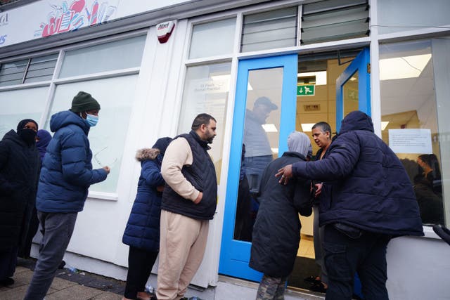 People queuing outside a dental practice after it opened registrations for NHS patients (PA)