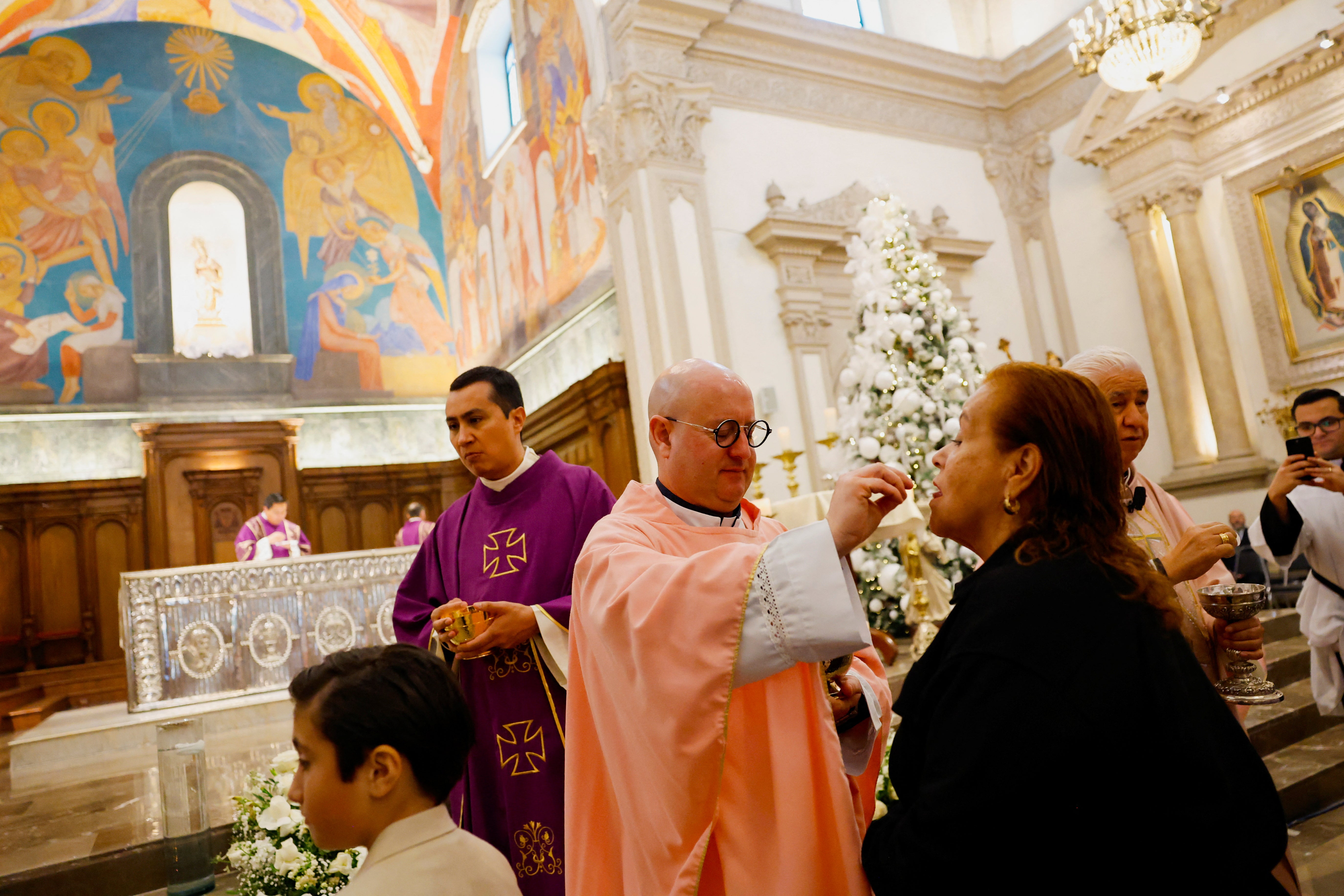 Father Peixoto attends a mass confirmation ceremony at the Metropolitan Cathedral of Our Lady of Monterrey