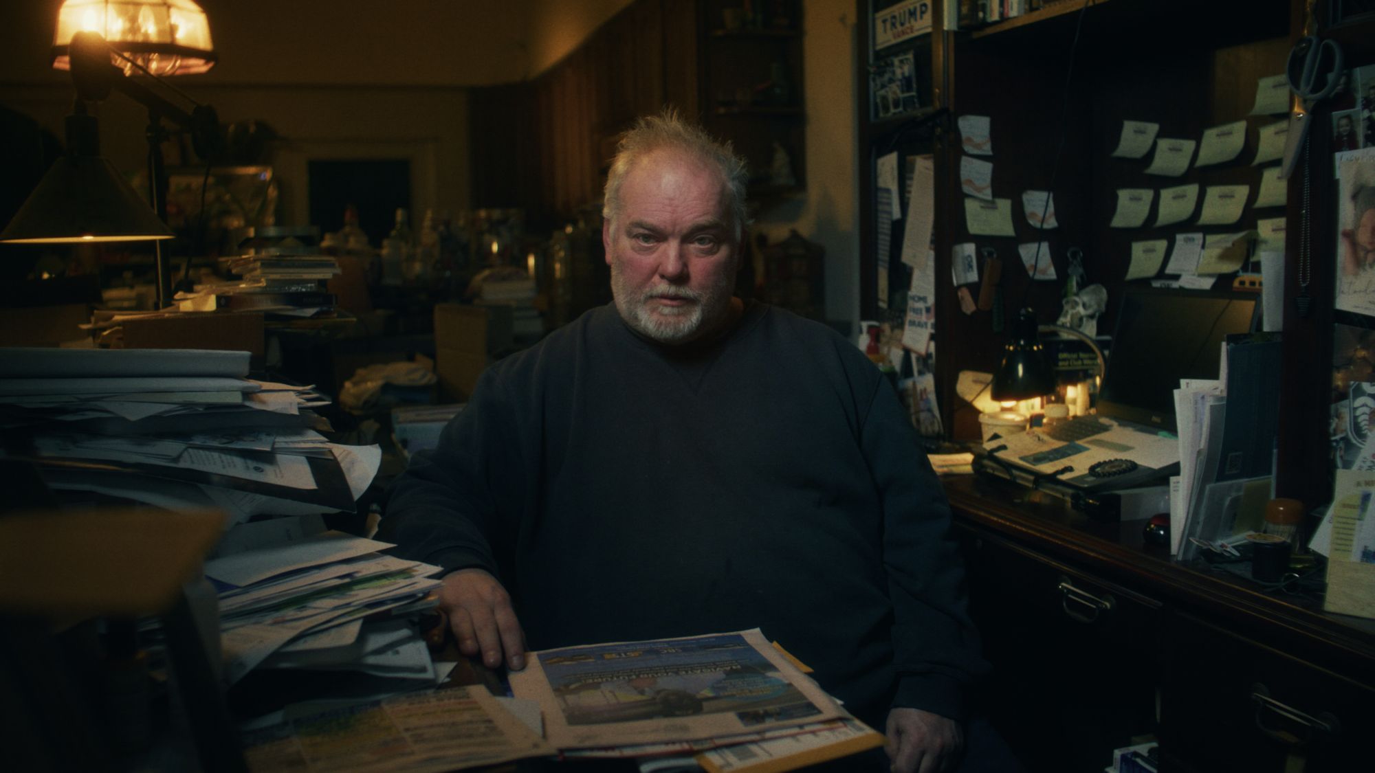 Mike Carroll sitting at his desk at his home on Long Island. He spent years searching for his father - only to make a grim discovery