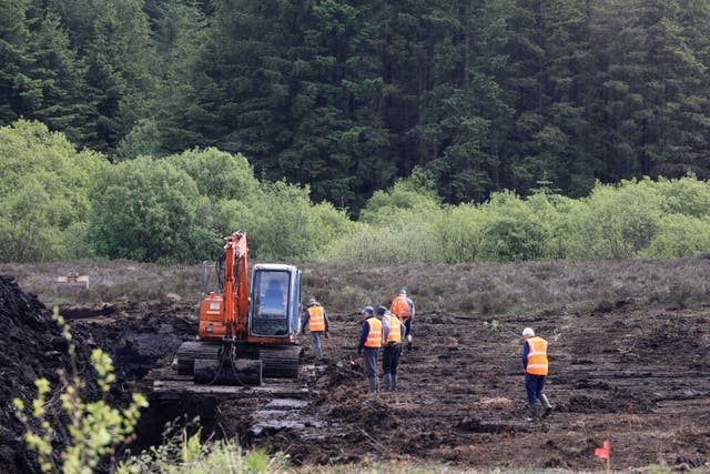 Members of the Independent Commission for the Location of Victims’ Remains working at Bragan Bog in Co Monaghan (PA)