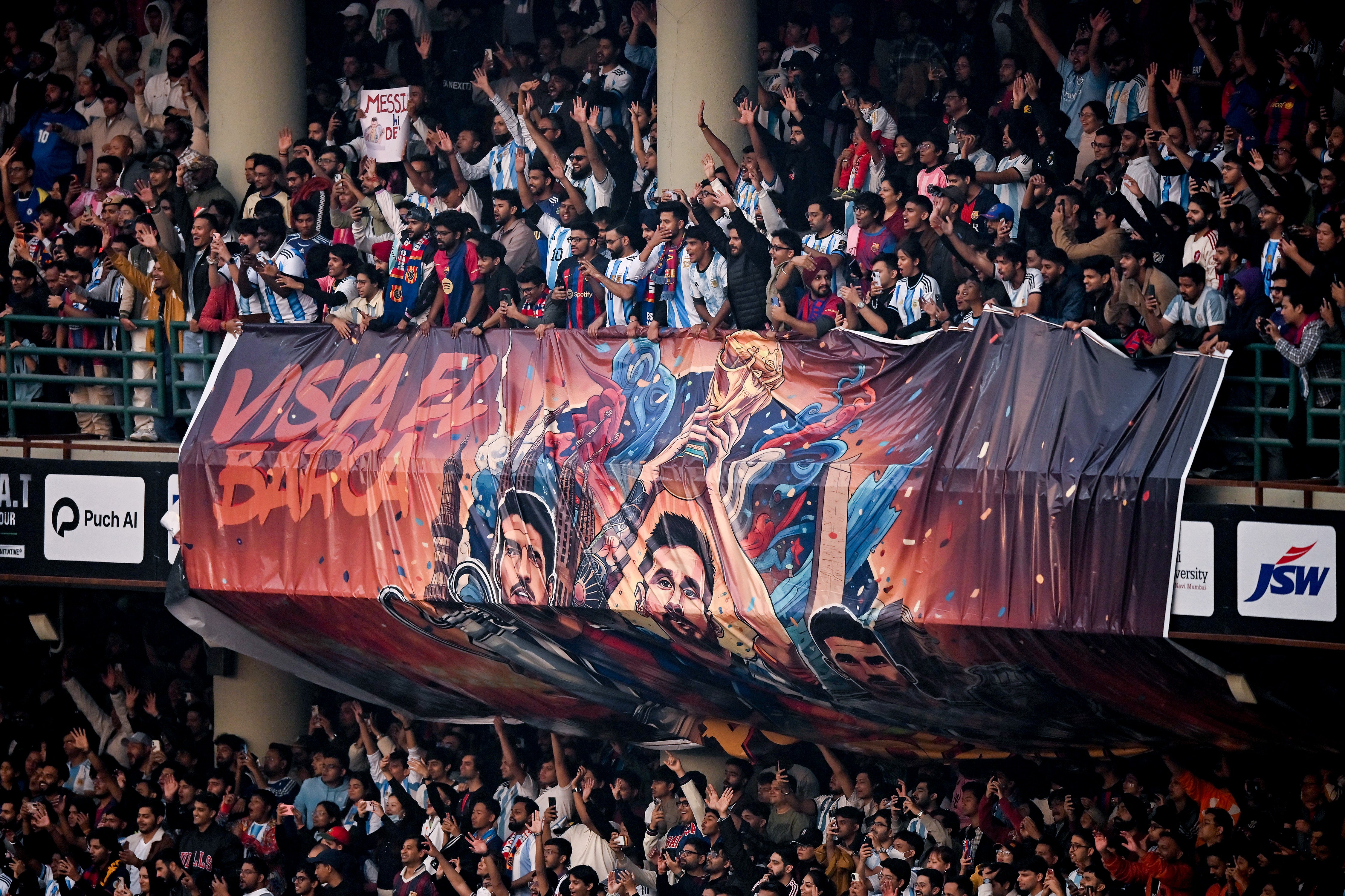 Fans display a banner at Arun Jaitley Cricket Stadium during Lionel Messi’s visit on 15 December 2025