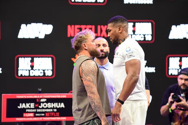 <p>Jake Paul and Anthony Joshua during a press conference </p>