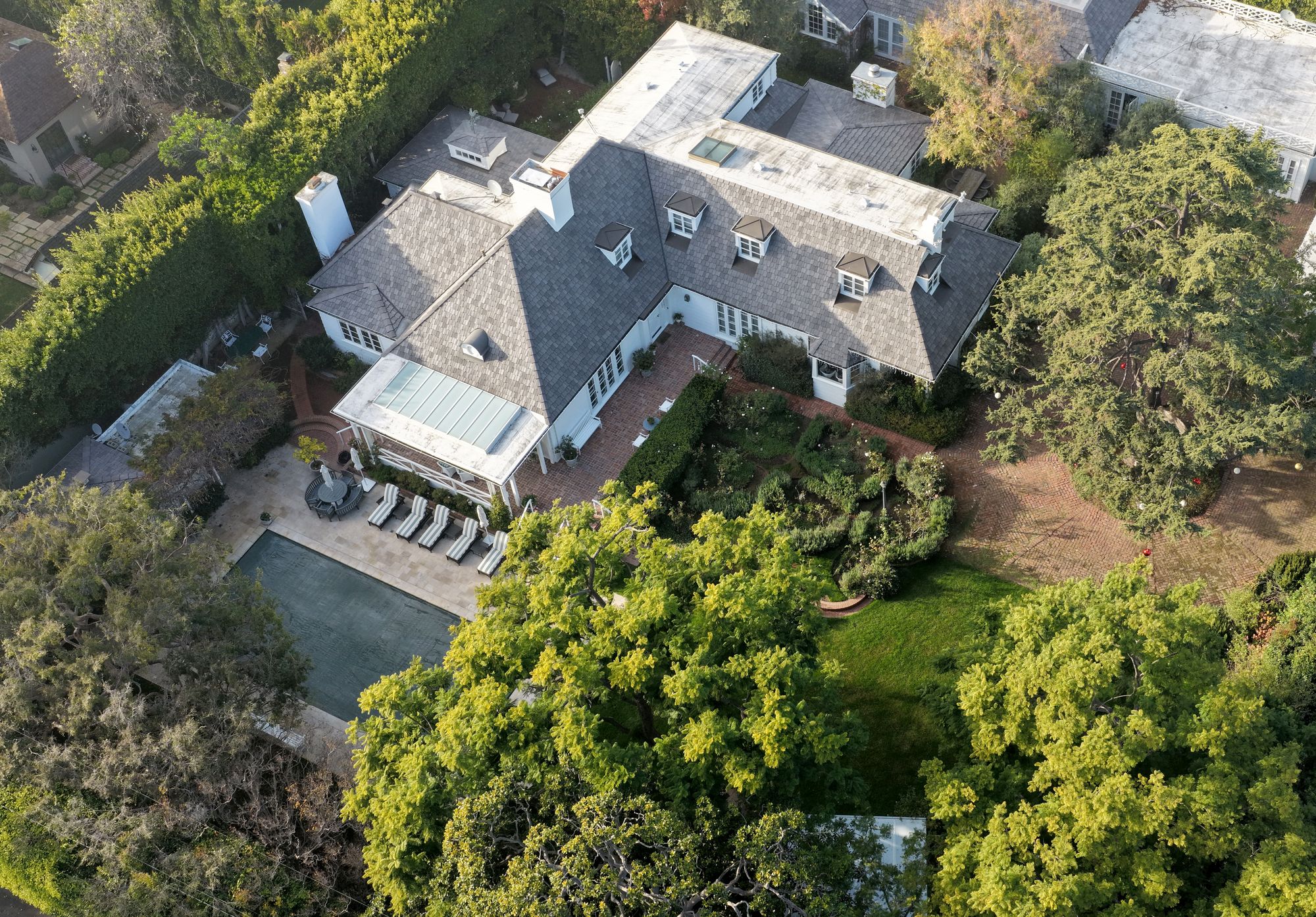 An aerial view of director Rob Reiner's home on December 16, 2025 in Brentwood, California. The LAPD confirmed that Rob Reiner and his wife Michele Singer Reiner were found dead in their home. Their son Nick Reiner was arrested in connection with their deaths, and will be charged with two counts of first-degree murder, according to the Los Angeles County district attorney