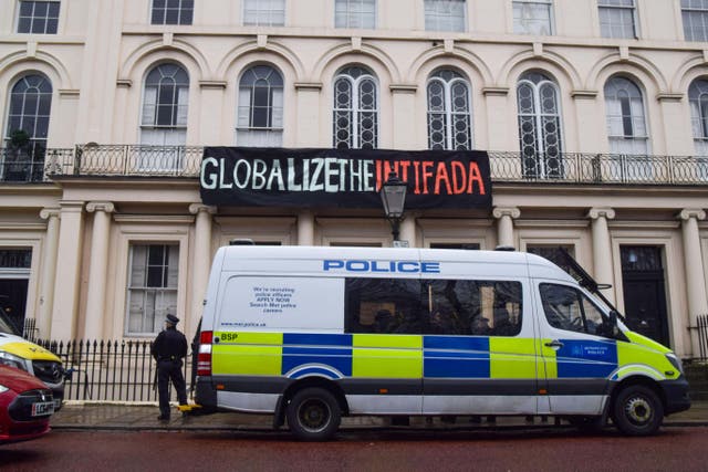 A protest banner in London in December 2023 reading Globalize the Intifada (Alamy/PA)