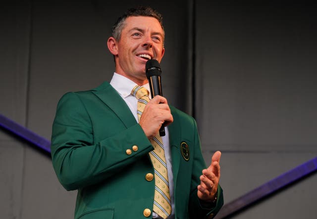 <p>Rory McIlroy, sporting his Green Masters Jacket, speaks to the crowd </p>