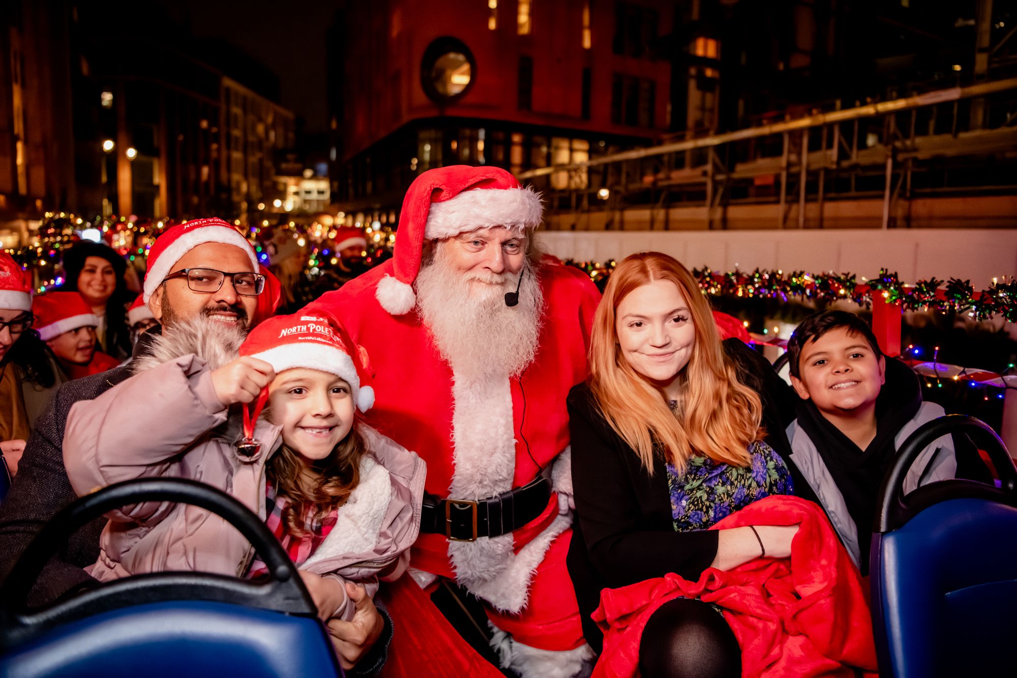 Meet Father Christmas on an open-top bus